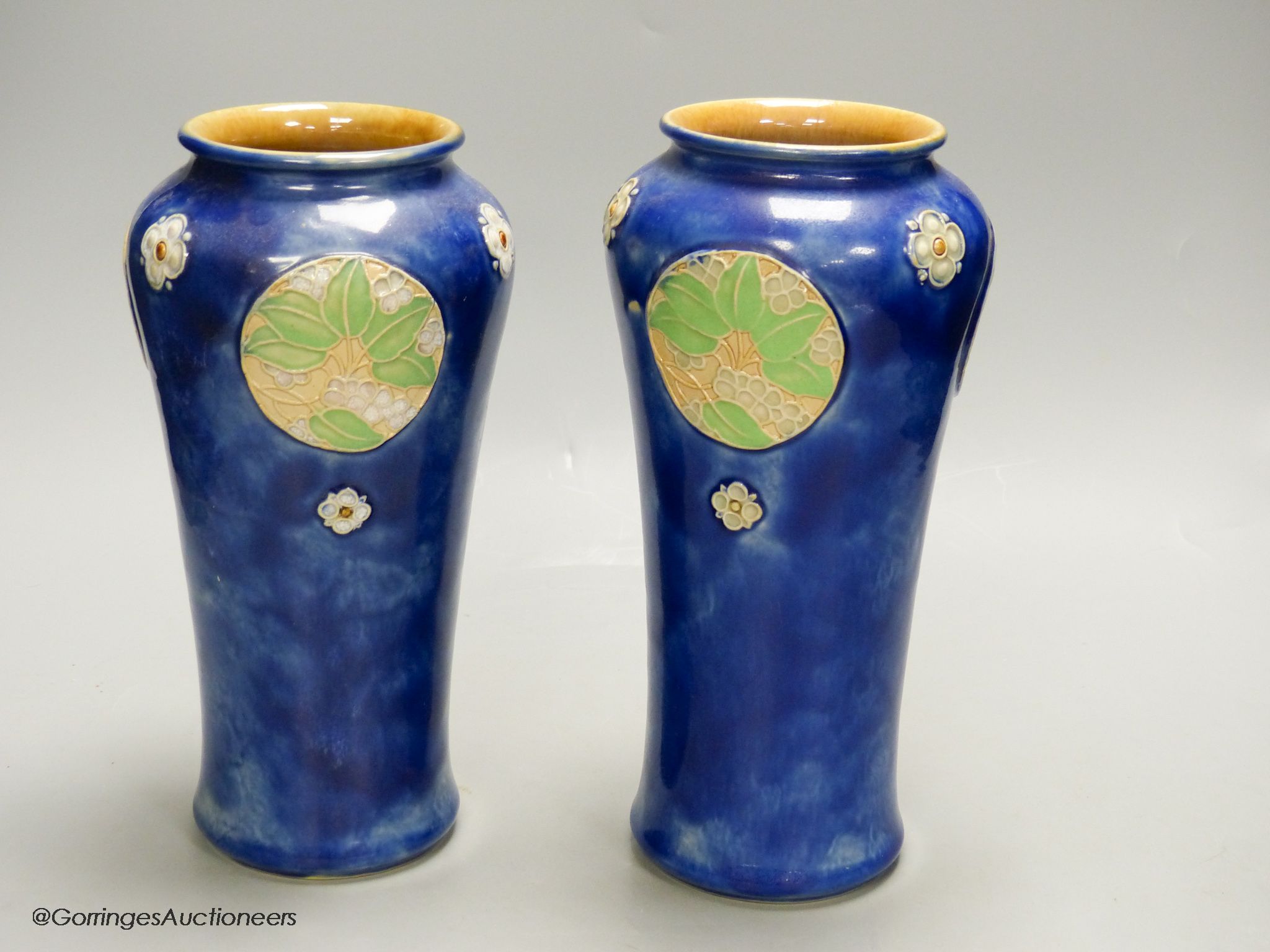 A pair of Royal Doulton blue glazed vases, height 24.5cm